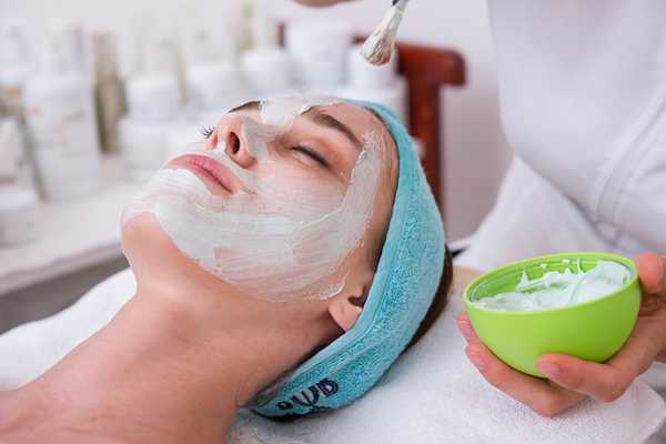 Girl laying receiving a facial treatment